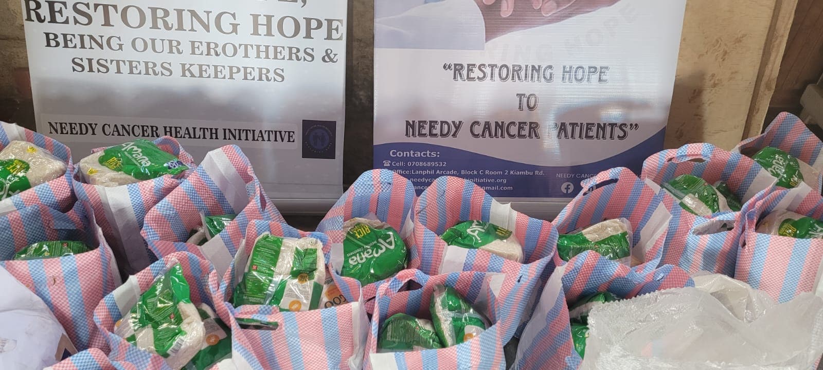 Rows of woven bags packed with rice for the NCHI food bank